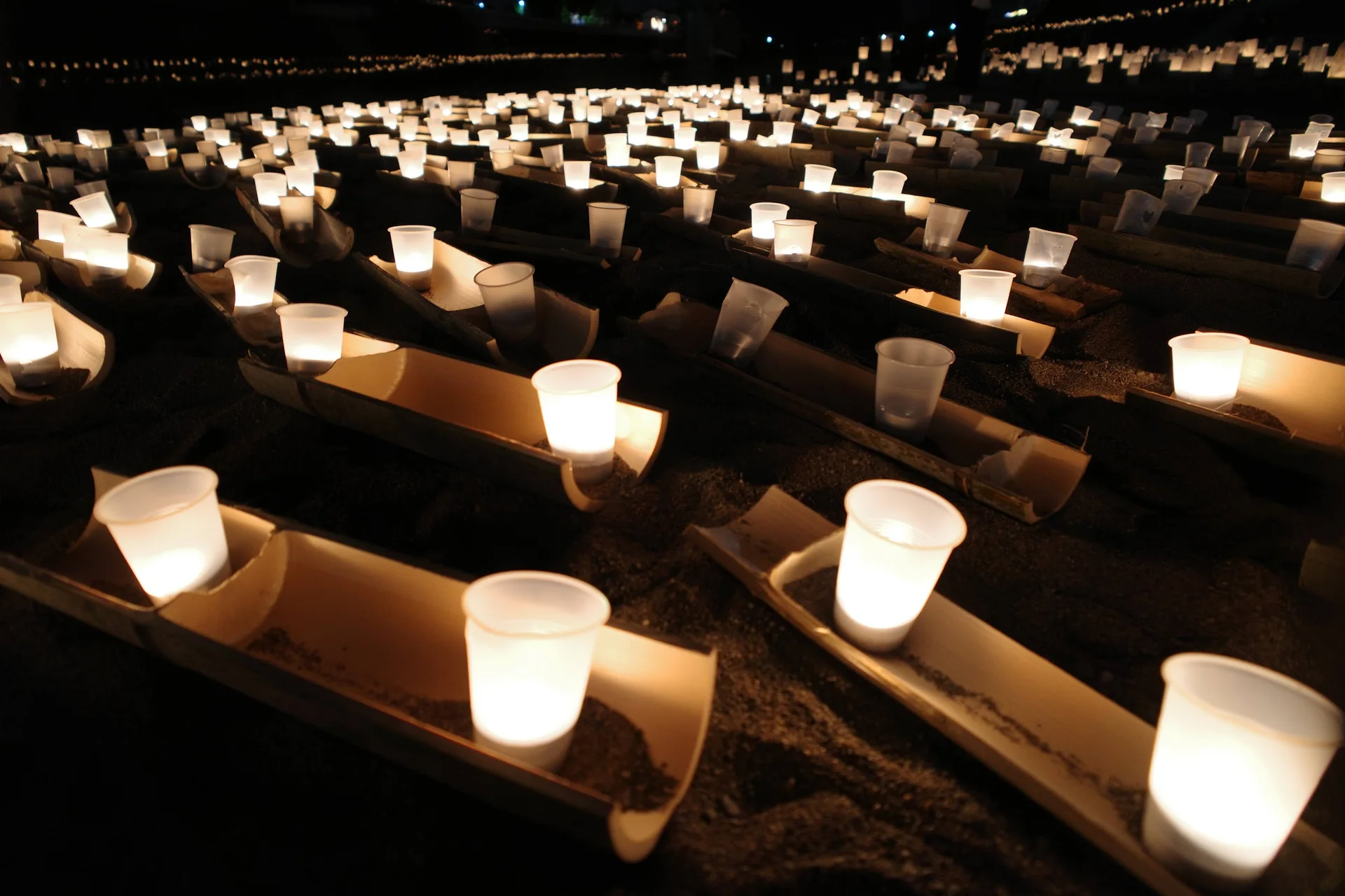 Sennen Akari candle displays beside the Kagetsu River in Hita