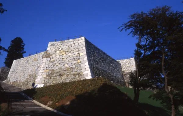 Restored stone walls at Nihonmatsu Castle honmaru showing multiple phases of castle construction
