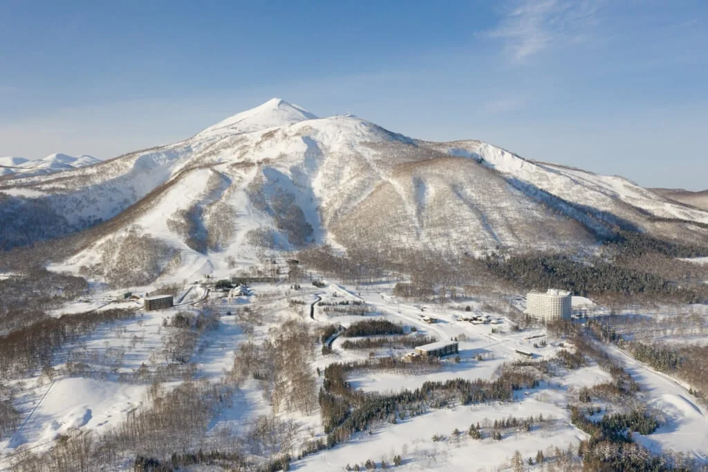 Snow-covered Hokkaido landscape: February requires insulated outerwear and snow-ready footwear rather than ordinary city winter shoes.
