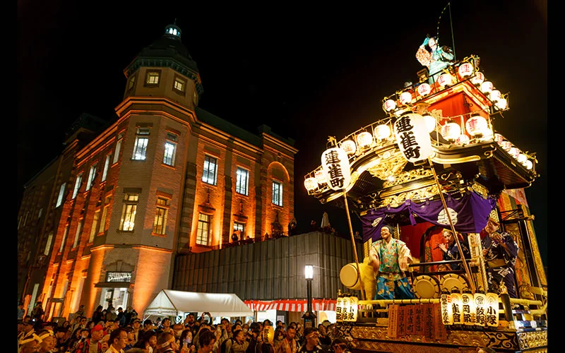Kawagoe Festival after dark with illuminated floats and festival music in the street