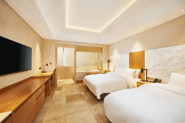 Twin room and bathroom layout at Arban Hotel Busan