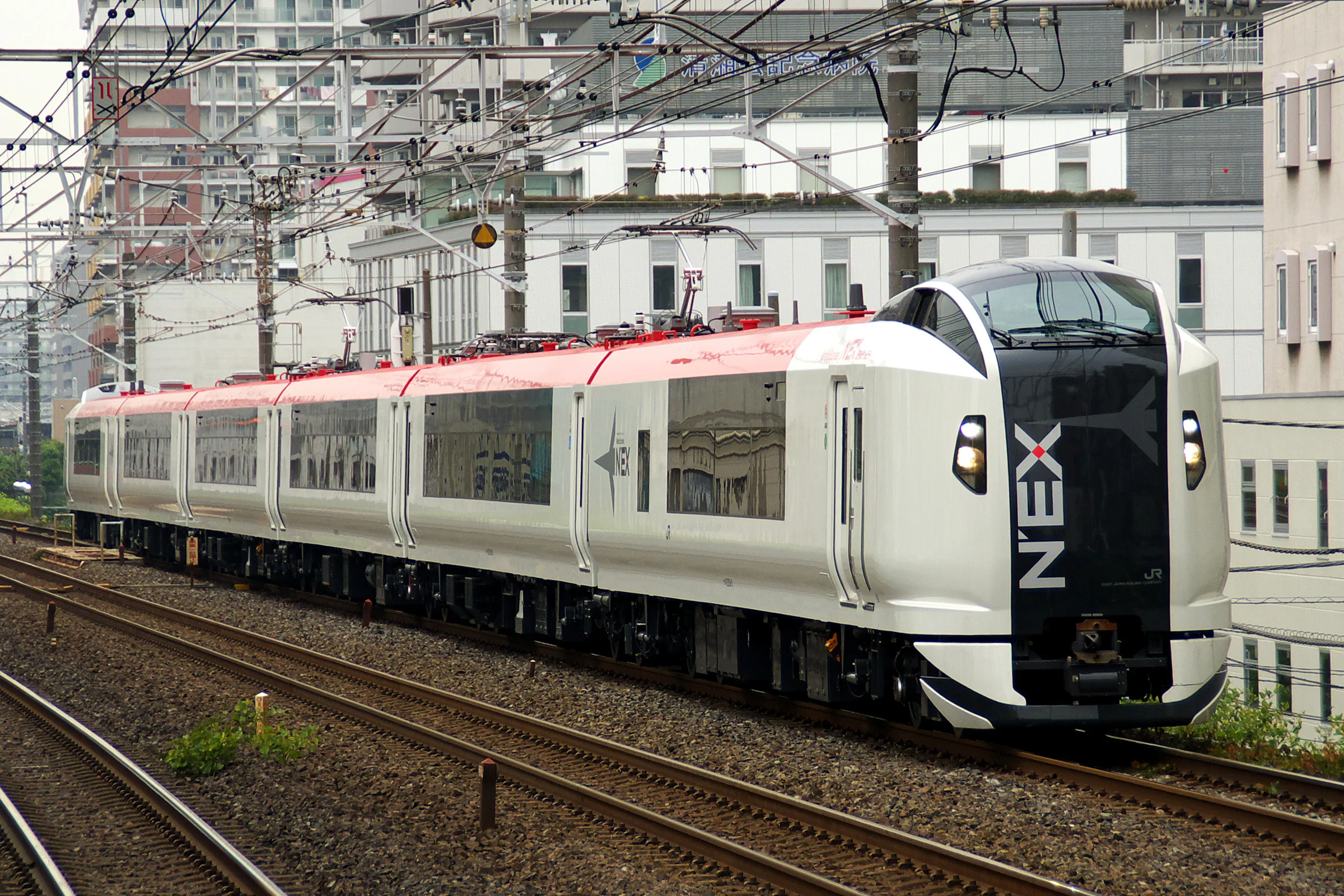 Narita Express train; a Skyliner add-on can duplicate airport transport when the JR TOKYO Wide Pass is already active