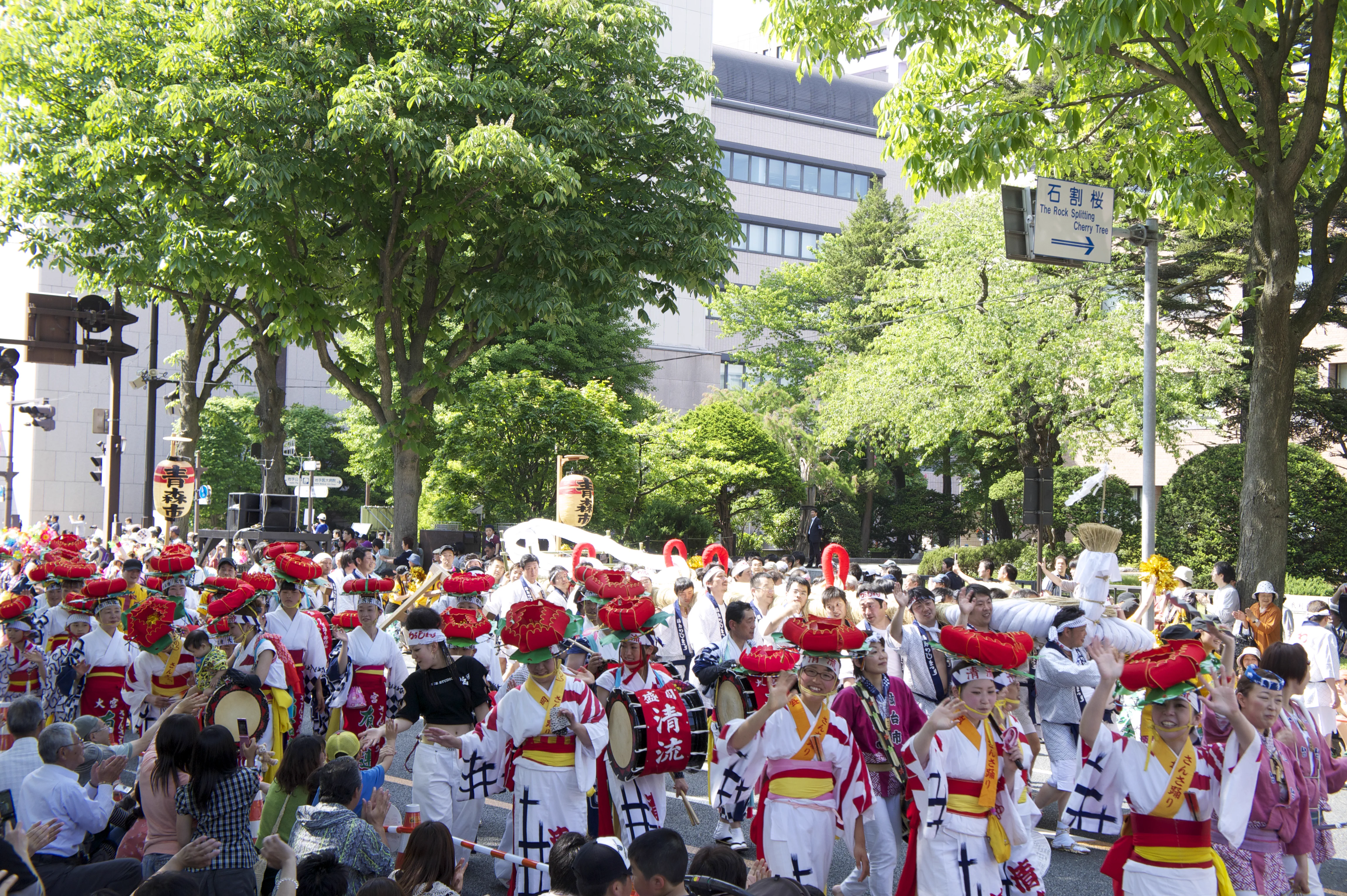 Fukushima Waraji Festival participants carrying the giant waraji through the street parade
