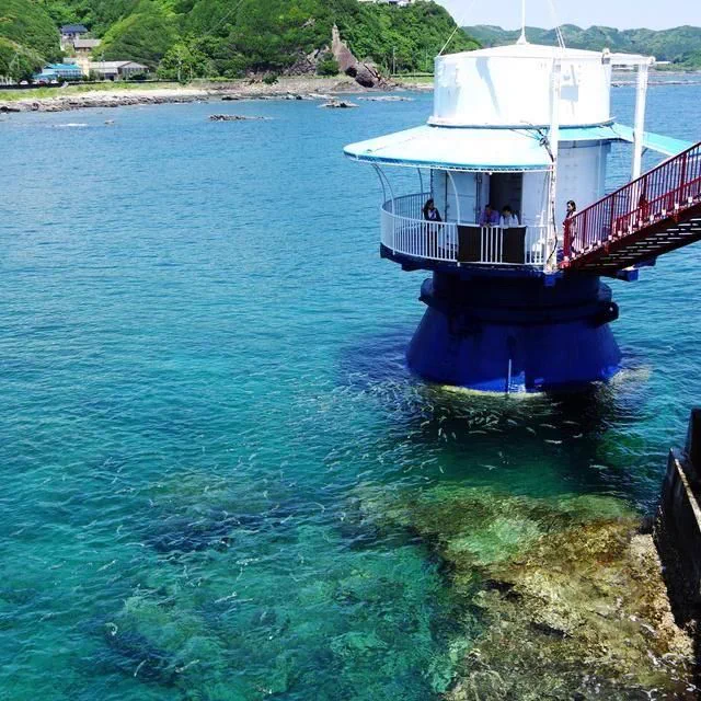 Red bridge leading to the underwater observation tower at Kushimoto Marine Park