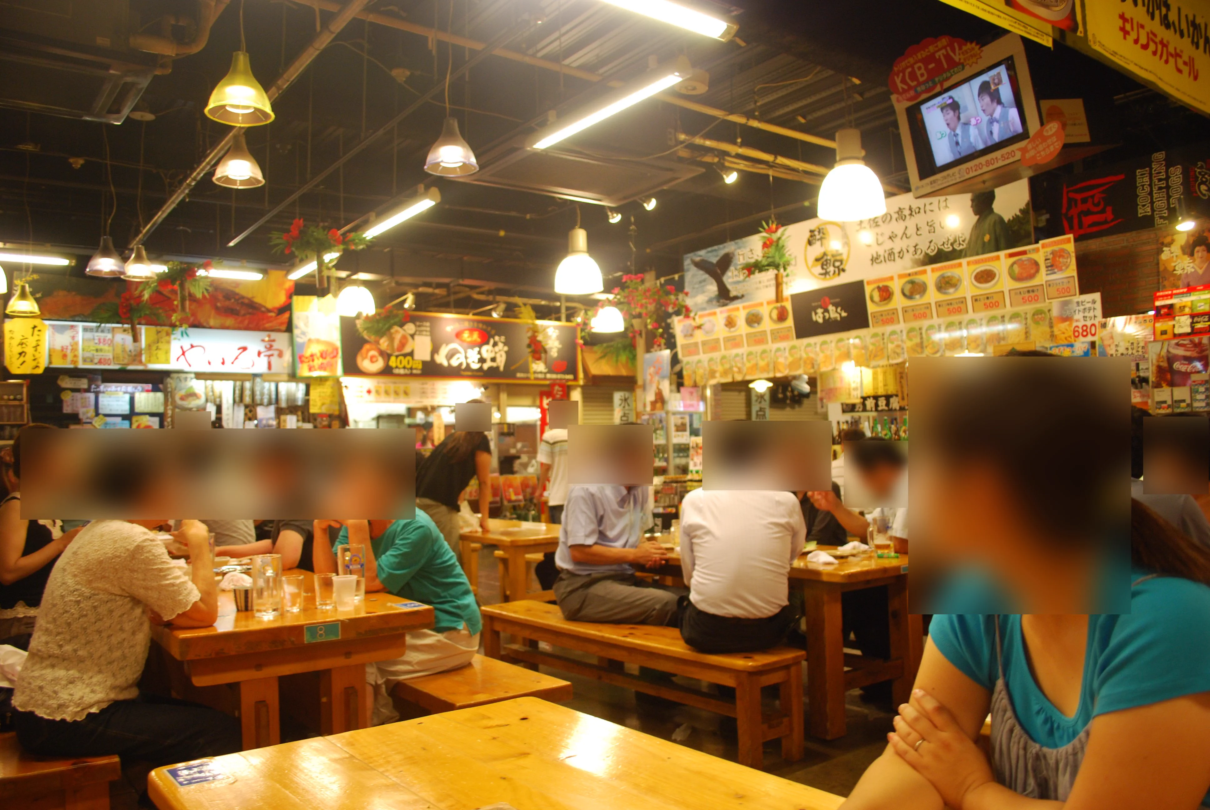 Communal tables and food stalls inside Hirome Market