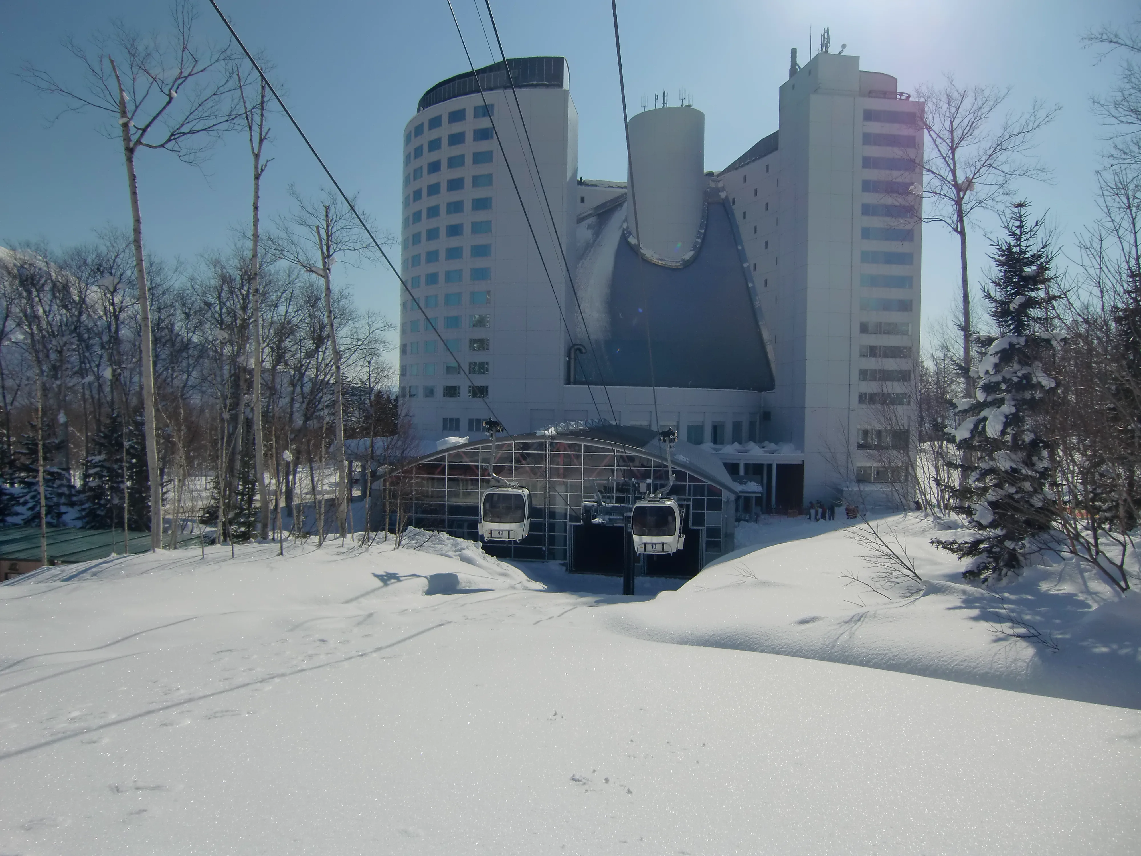 Niseko Gondola beside a resort hotel illustrating slope-side accommodation