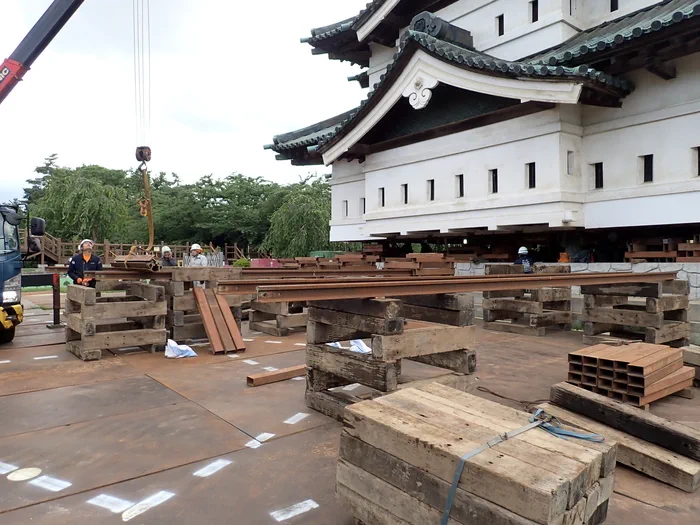 Rails and return-work setup used to move Hirosaki Castle keep back toward its original base in 2026