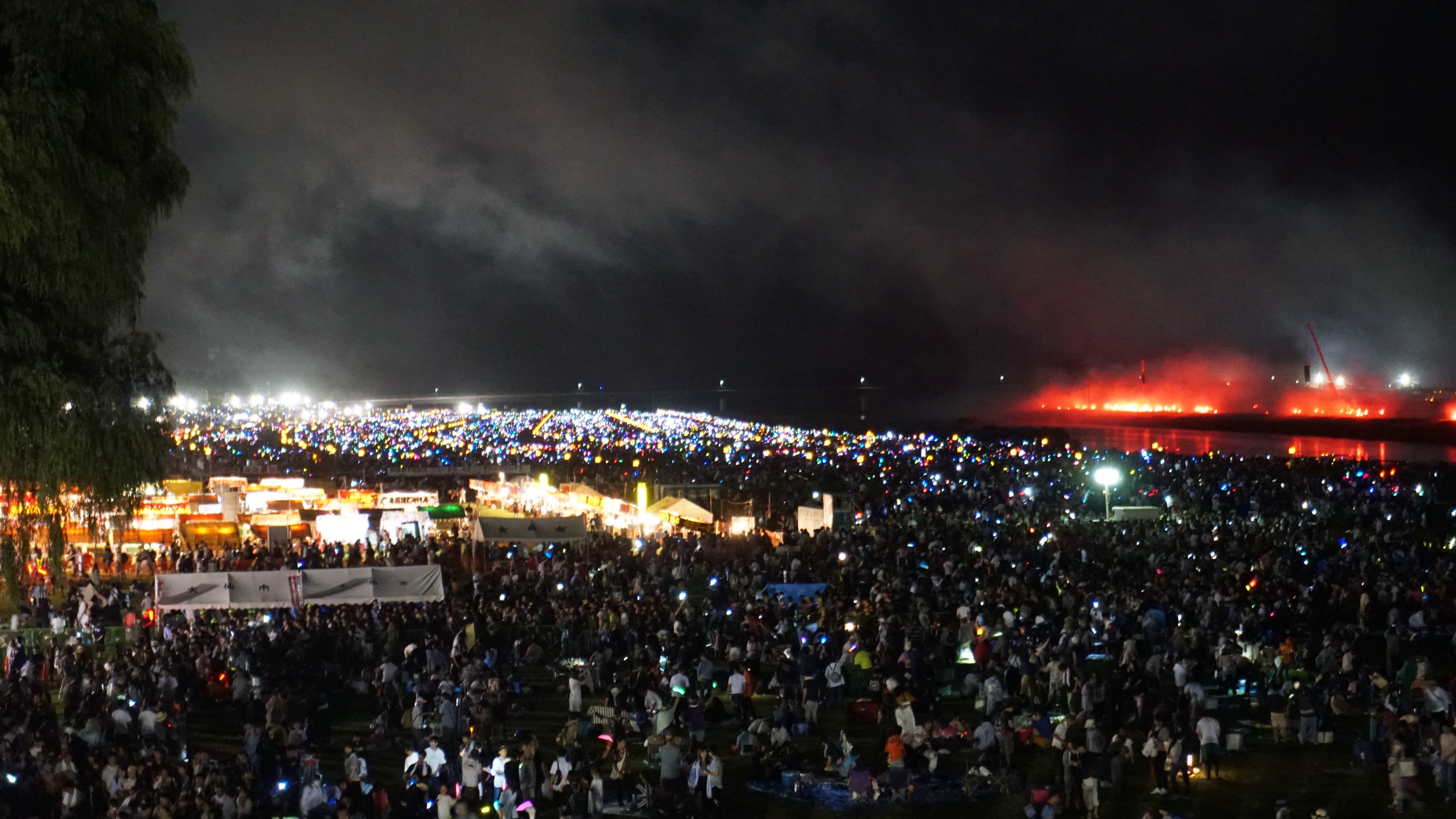 Omagari Fireworks finale over the riverbank crowd before the post-show exit