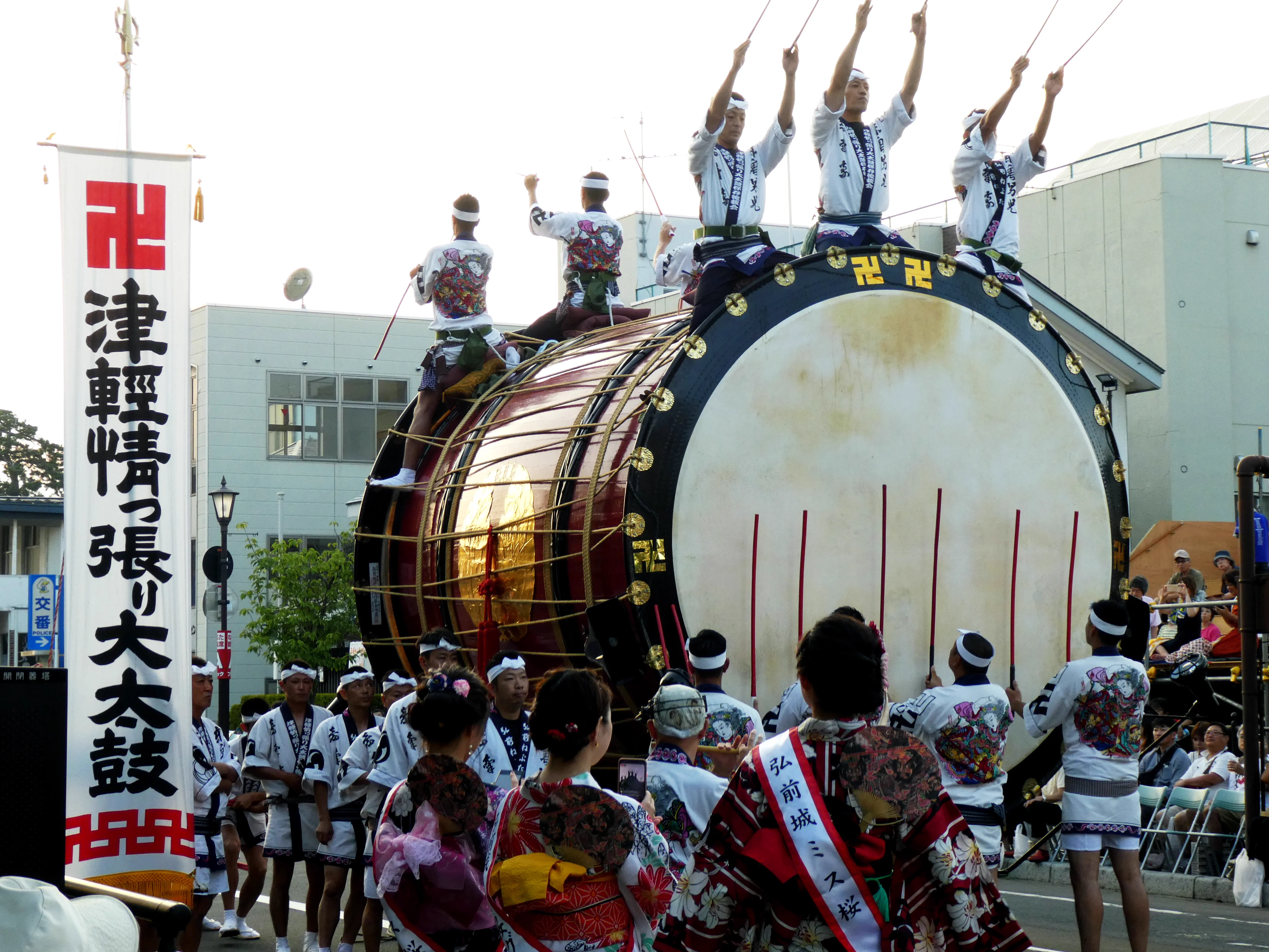 Hirosaki Neputa participants and illuminated float moving through the street