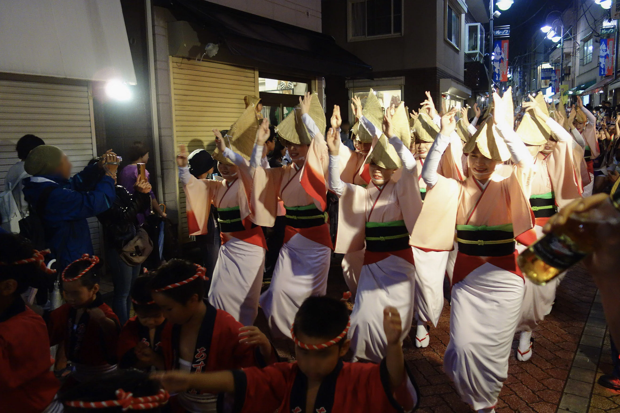 Koenji Awa Odori dancers illustrating the difference between a seated stage show and the street festival