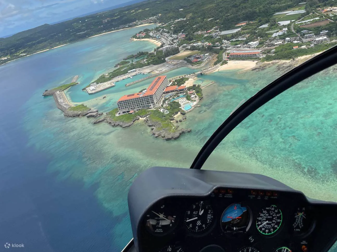 Aerial view of coral reefs and the Onna resort coast from an Okinawa helicopter. The real difference between 4, 12, 20 and 35 minutes is how far the route reaches.