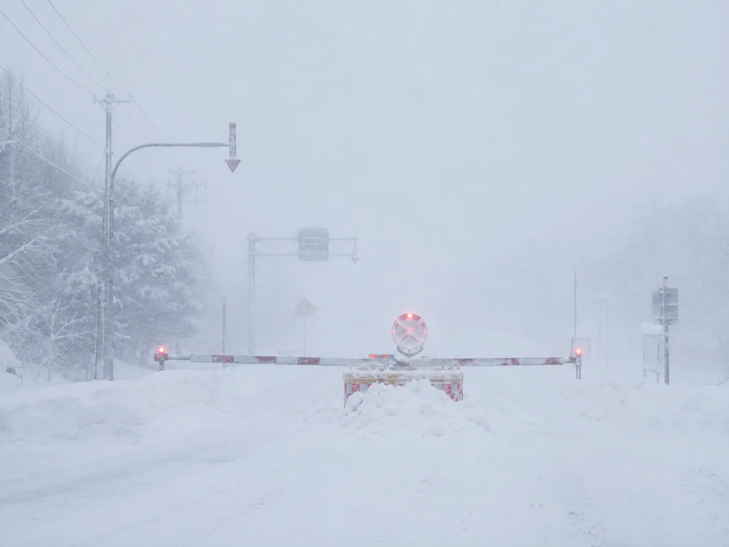 Hokkaido blizzard whiteout and road closure barrier