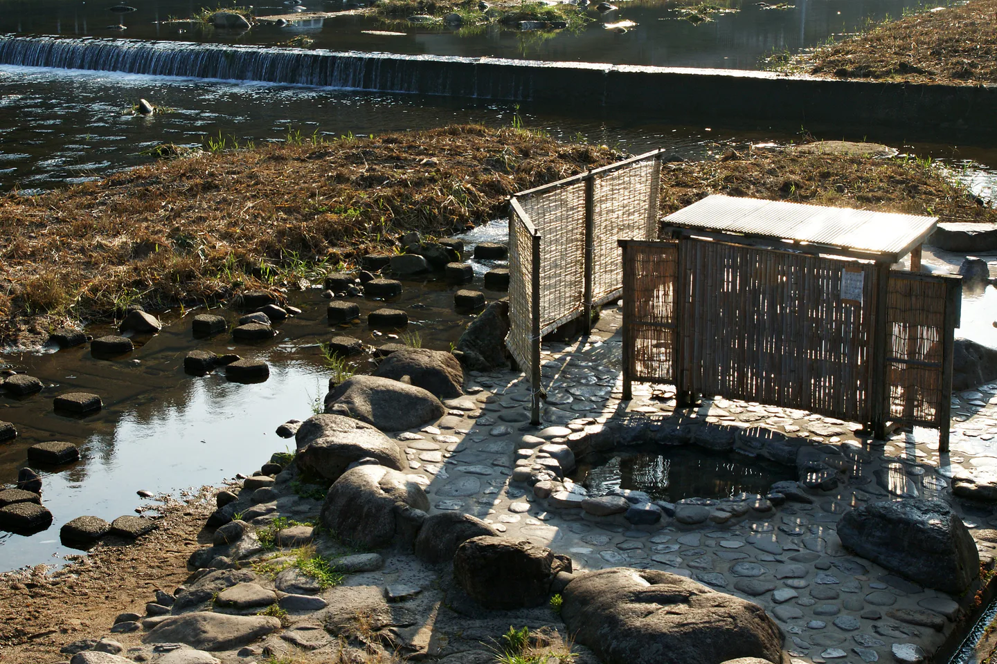 Misasa Onsen riverside hot-spring scene for a Misasa Onsen vs Kurayoshi stay comparison