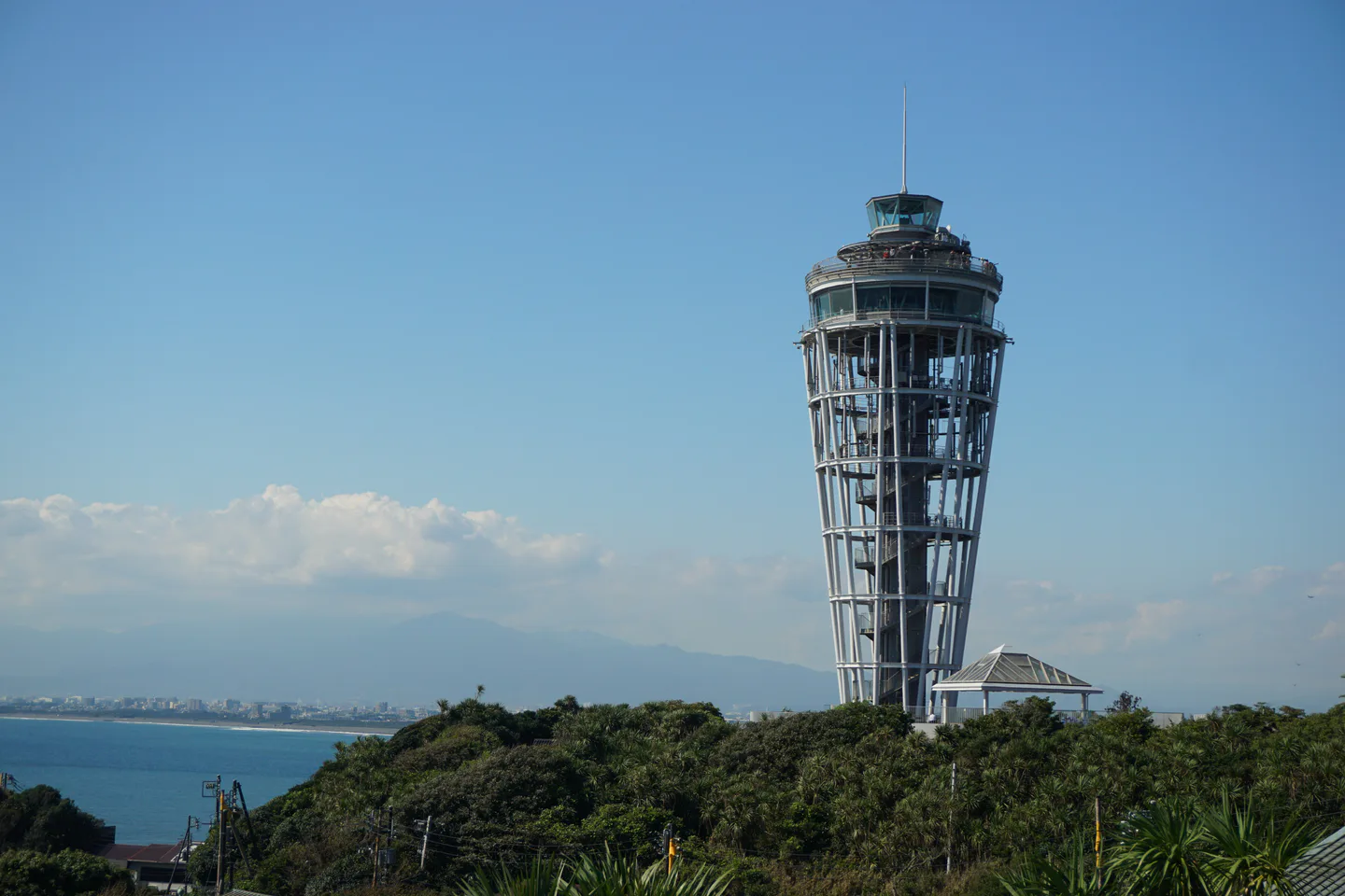 Enoshima Sea Candle above the island, for a Kamakura and Fujisawa two-night accommodation comparison