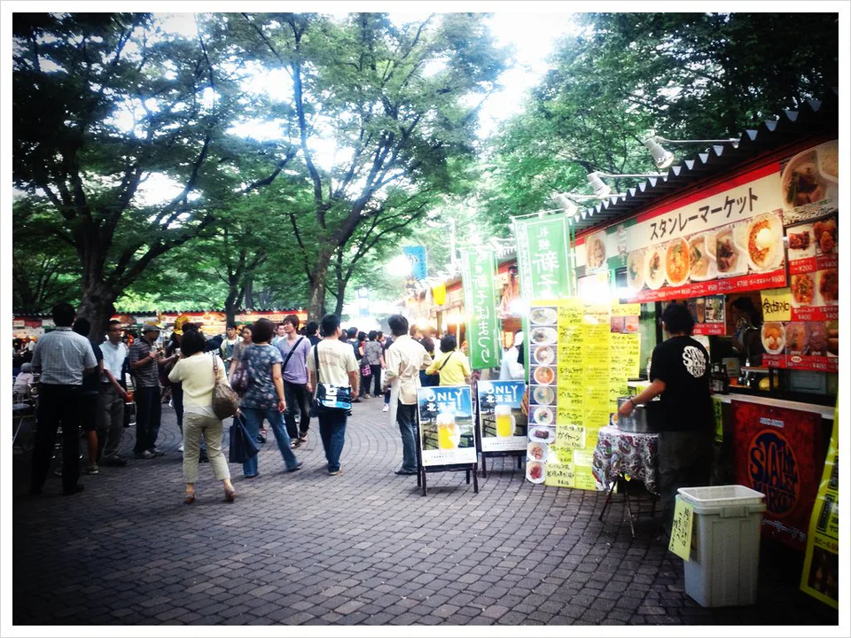 Sapporo Autumn Fest food stalls, outdoor seating and crowds in Odori Park