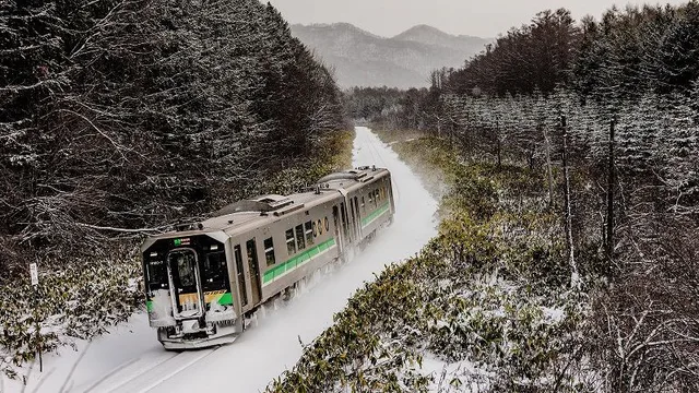 JR Hokkaido train in winter snow for a car-free Sapporo and Otaru segment